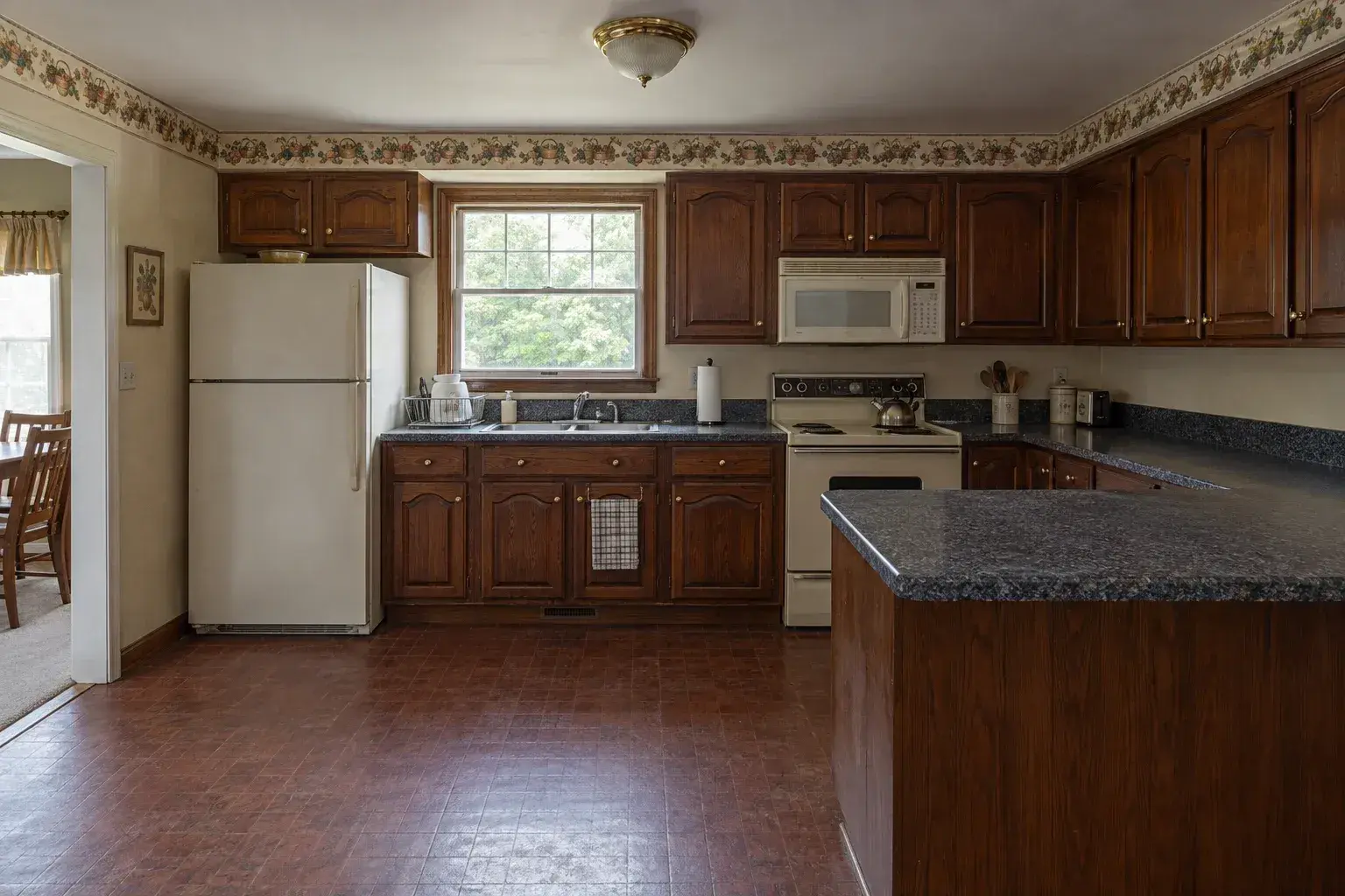 Dark cherry cabinetry before the renovation