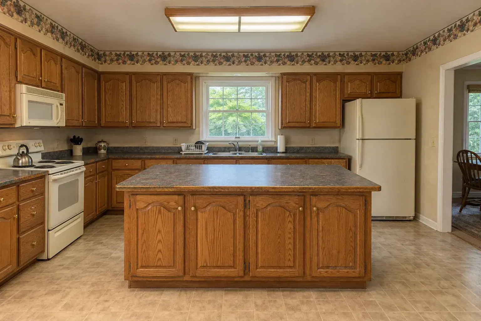 Riverside kitchen with dated oak cabinets before the remodel